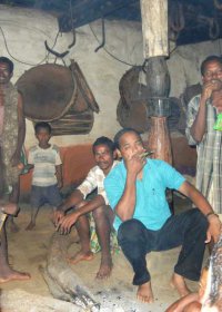 Author trying tobacco pipe at Mandaghara